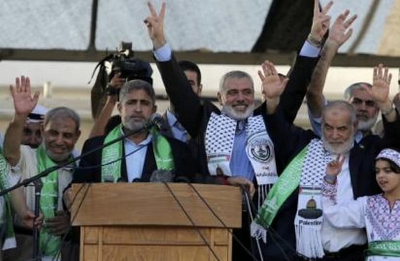 Hamas Gaza leader Ismail Haniyeh celebrates in Gaza what they say was a victory over Israel, in Gaza City August 27  (photo credit: REUTERS)