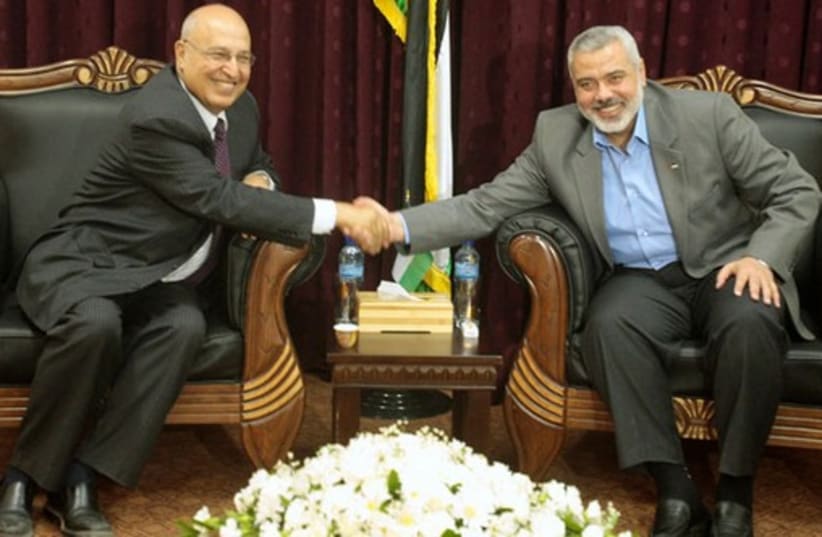 Fatah official Nabil Shaath (L) and Hamas deputy political bureau chief Ismail Haniyeh. (photo credit: REUTERS)