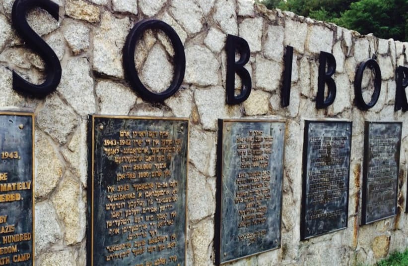A SIGN marks the site of the Sobibor death camp, obliterated by the Nazis to hide their crimes after the prisoners’ revolt in 1943. (photo credit: FROM THE DEPTHS)
