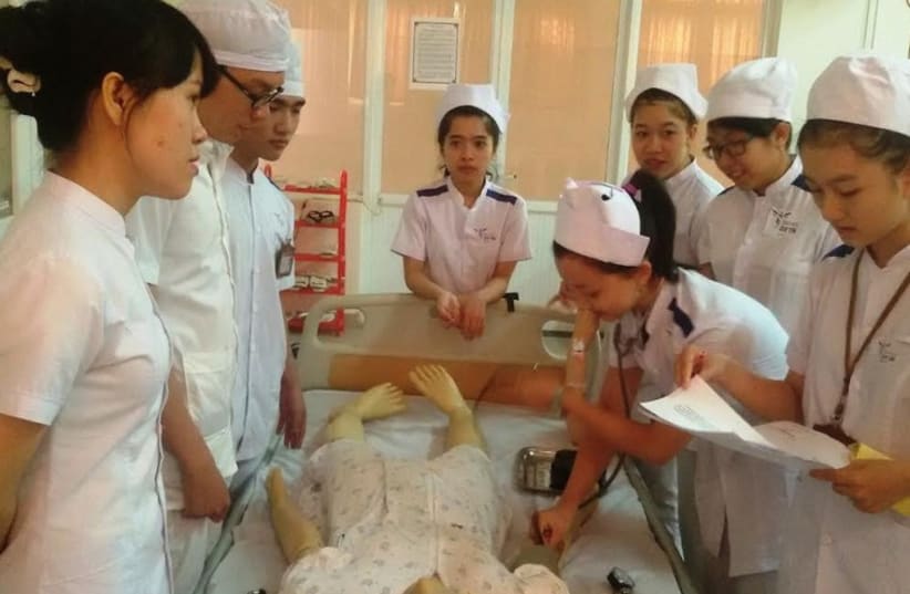 Visiting nursing students from Vietnam undergo instruction at Ben-Gurion University. (photo credit: Courtesy)