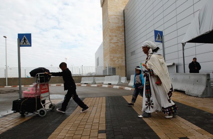 Ethiopian Jewish immigrants leave Ben-Gurion Airport in 2011. (photo credit: REUTERS)