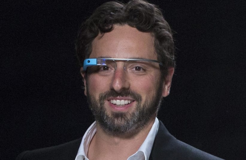 Google co-founder Sergey Brin walks the runway wearing new product "Glass by Google". (photo credit: REUTERS)