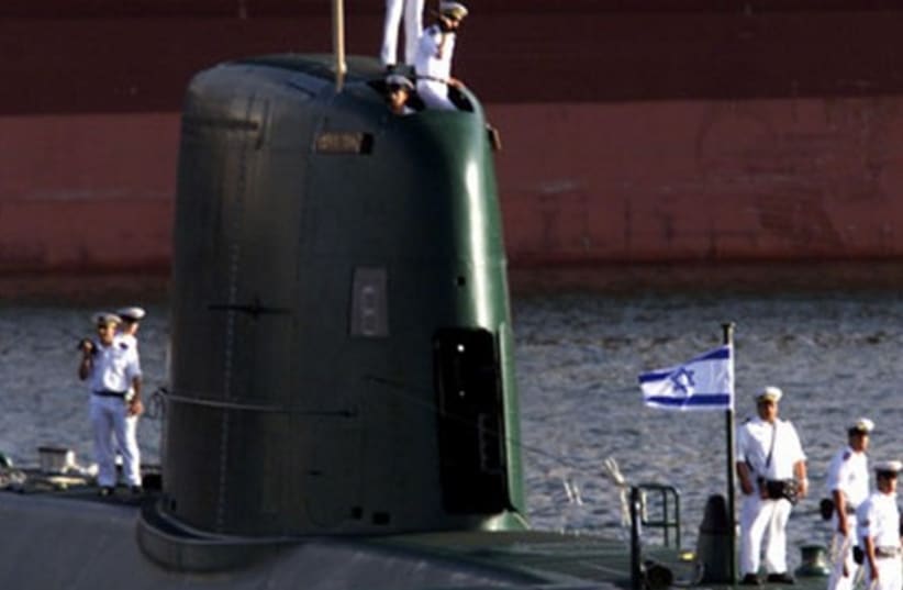 A Dolphin-class submarine enters Haifa port. (photo credit: REUTERS)