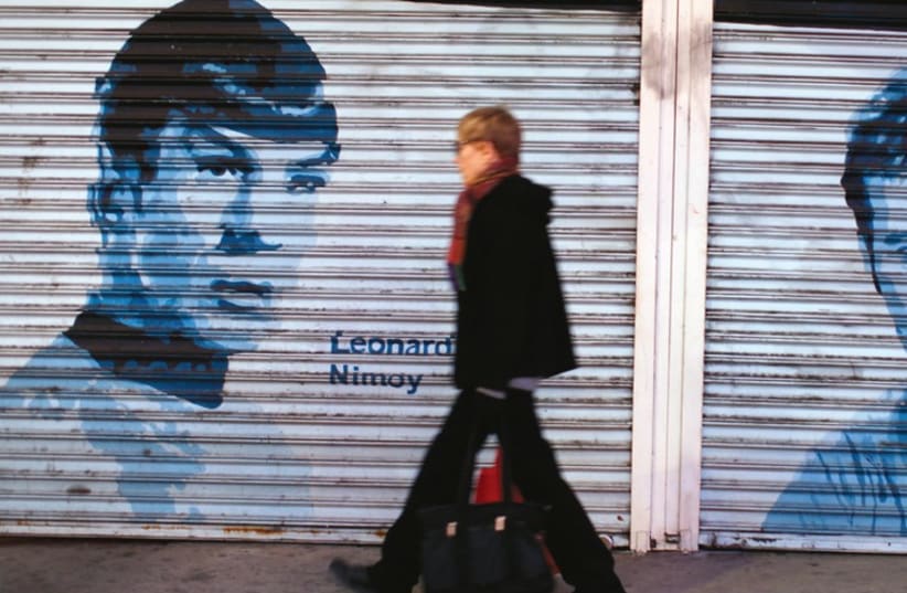 Pictures of original ‘Star Trek’ actors Leonard Nimoy and William Shatner painted onto storefront security gates on Hollywood Boulevard in Hollywood. (photo credit: REUTERS)