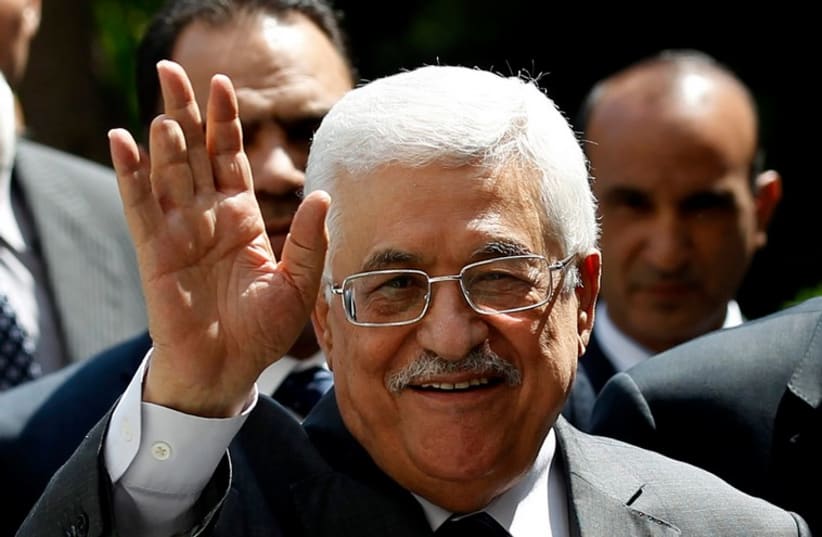 Palestinian Authority President Mahmoud Abbas arrives for an Arab League Foreign Ministers emergency meeting at the league's headquarters in Cairo (photo credit: REUTERS)