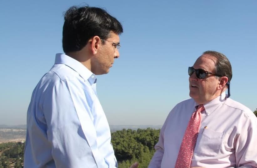 Likud MK Danny Danon and US politician Mike Huckabee in the West Bank, Sept. 7, 2014 (photo credit: TOVAH LAZAROFF)