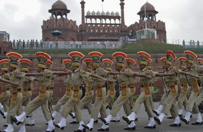 Indian soldiers march past the historic Red Fort during Independence Day celebrations in Delhi. (photo credit: REUTERS)