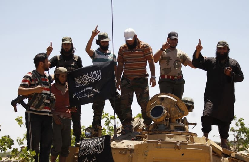Jabhat Al-Nusra militants (photo credit: REUTERS)