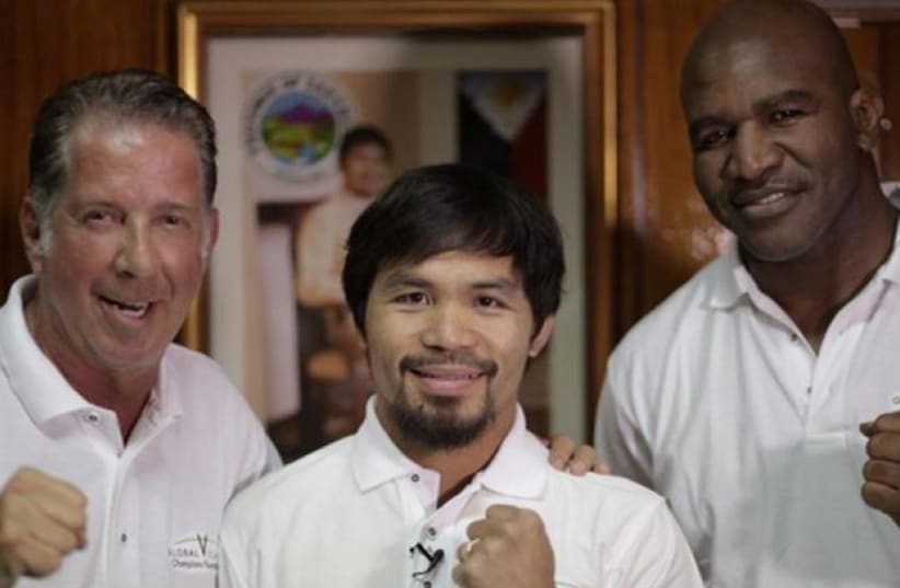 From left, Yank Barry, boxing champion Manny Pacquiao, and retired champ Evander Holyfield. (photo credit: PR)