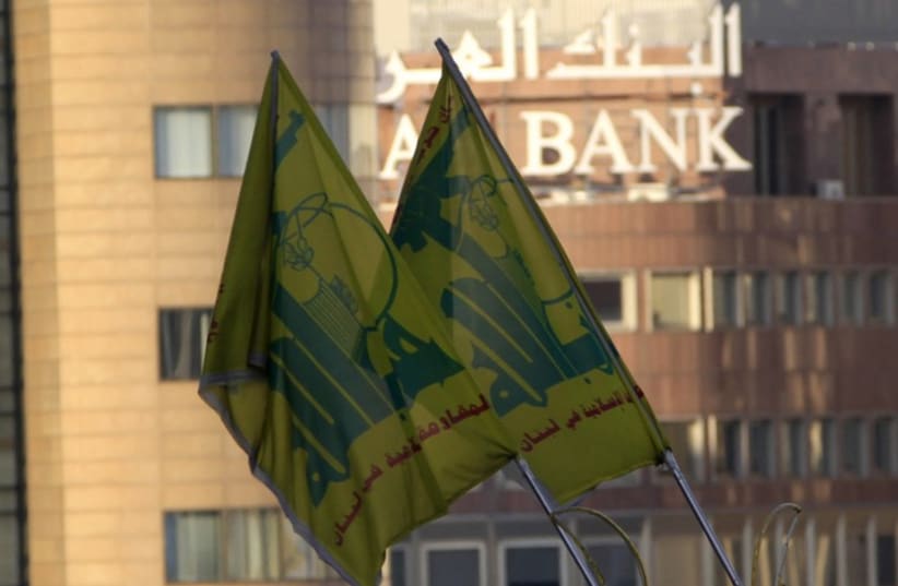 Hezbollah flags seen in front of Arab Bank building in Beirut (photo credit: REUTERS)