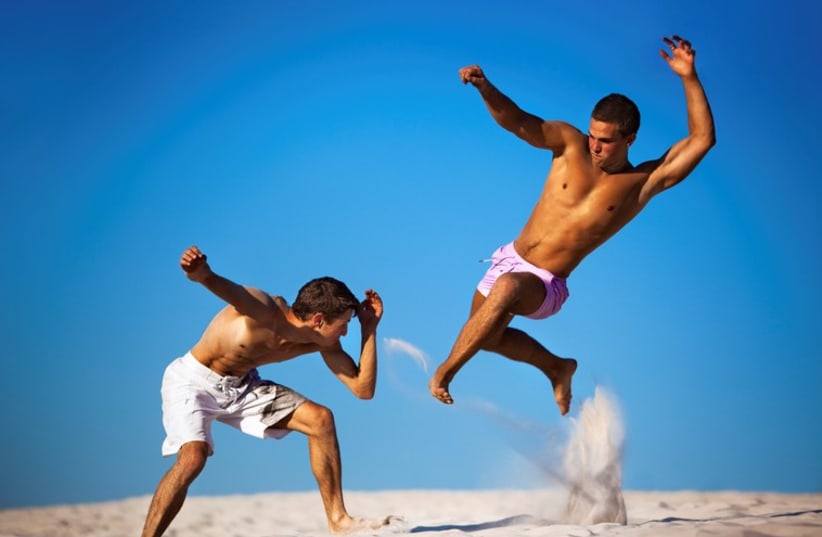 Sport fighting on a beach [Illustrative]. (photo credit: INGIMAGE)