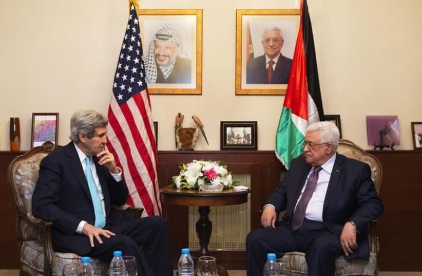 US Secretary of State John Kerry (L), meets with Palestinian Authority President Mahmoud Abbas, in Amman, Jordan March 26, 2014. (photo credit: REUTERS)