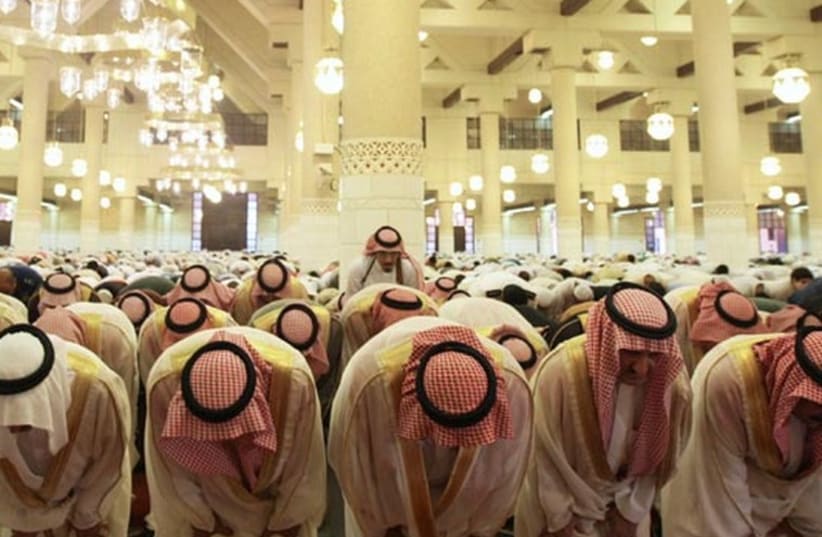 Saudis take part in Friday prayers. (photo credit: REUTERS)