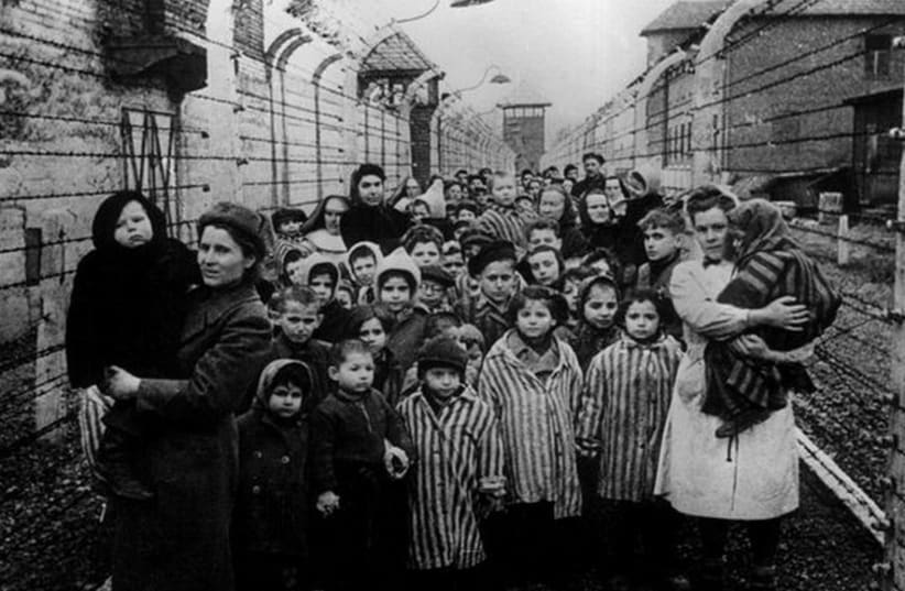 Holocaust survivors at Auschwitz. (photo credit: REUTERS)