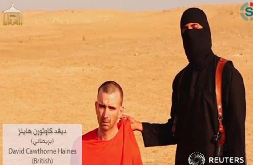 A still from the Islamic State video of David Cawthorne Haines video shortly before being executed by beheading. (photo credit: REUTERS)