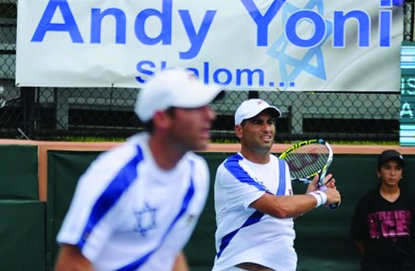 Andy Ram (right) and Yoni Erlich (left) recorded a thrilling five-set victory over Argentina’s Horacio Zeballos and Federico Delbonis in their final match together last night in Sunrise, Florida, giving Israel a 2-1 lead over Argentina in the World Group playoff tie. (photo credit: GADI/ITA)
