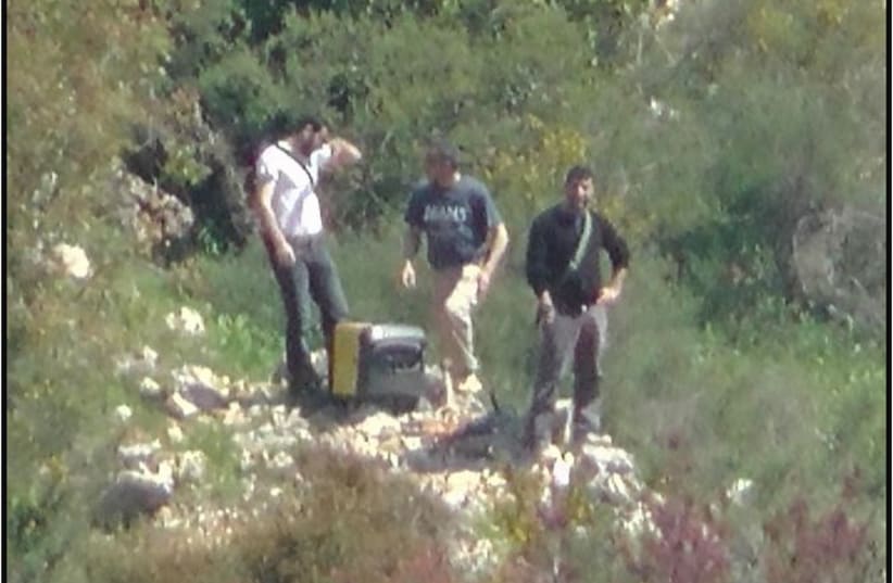 Openly armed Hezbollah members spotted near the Israeli border. (photo credit: Courtesy)