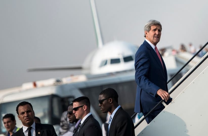 US Secretary of State John Kerry boards his plane (photo credit: REUTERS)