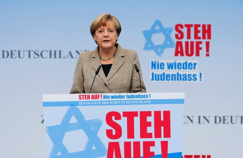 German Chancellor Angela Merkel makes an address during an anti-Semitism demo at Berlin's Brandenburg Gate September 14, 2014.  (photo credit: REUTERS)