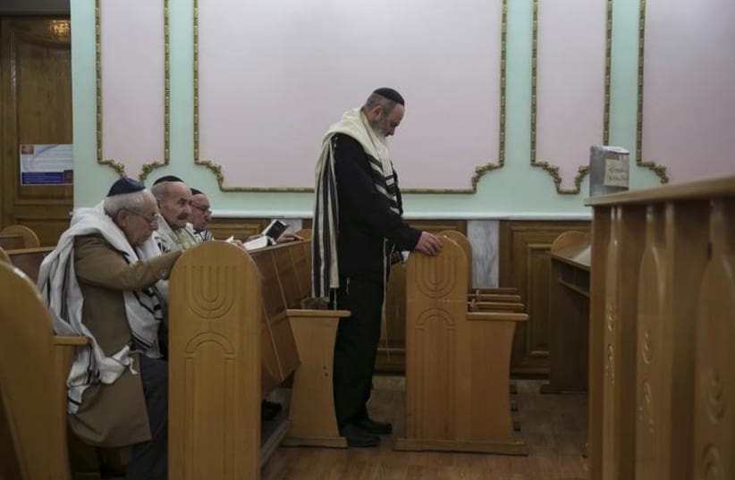 Jewish men at a synagogue in Donetsk, eastern Ukraine.  (photo credit: REUTERS)