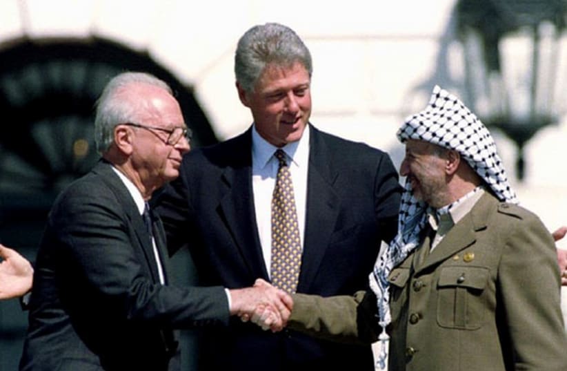 From left; Former prime minister Yitzhak Rabin, former US president Bill Clinton, and the late PLO leader Yasser Arafat on the White House lawn. (photo credit: REUTERS)