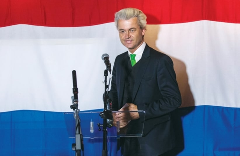 Far right dutch politician Geert Wilders of the antiimmigration Freedom (PVV) Party arrives at a PVV rally after the European Parliament elections. (photo credit: REUTERS)