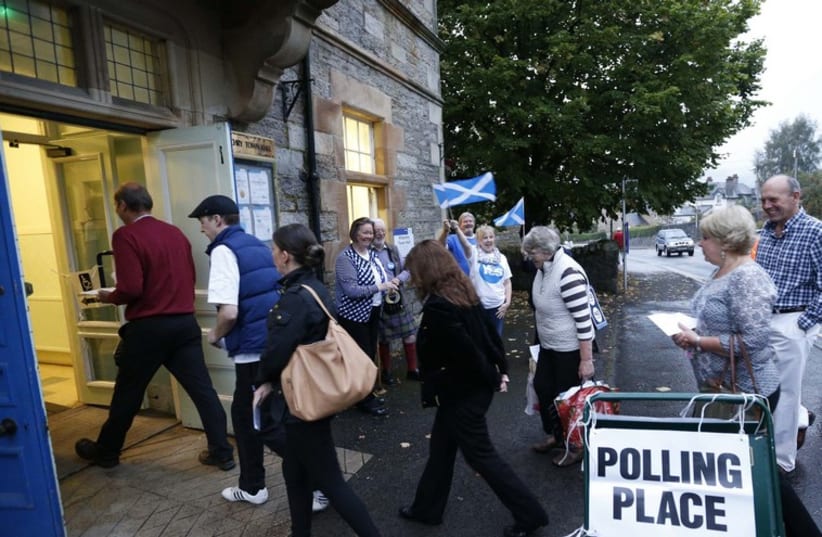 Scots vote in independence referendum (photo credit: REUTERS)
