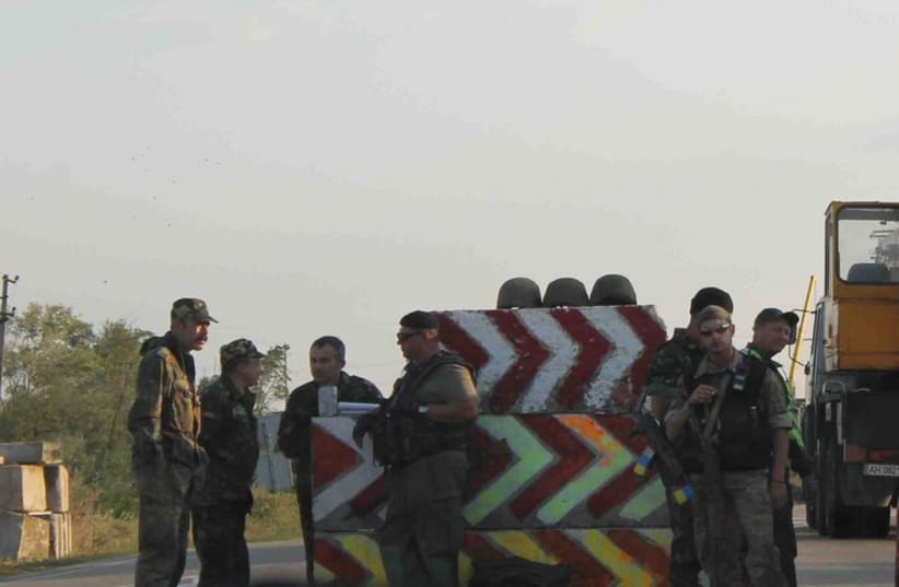 Ukrainian soldiers at a checkpoint outside of Mariupol last week (photo credit: SAM SOKOL)