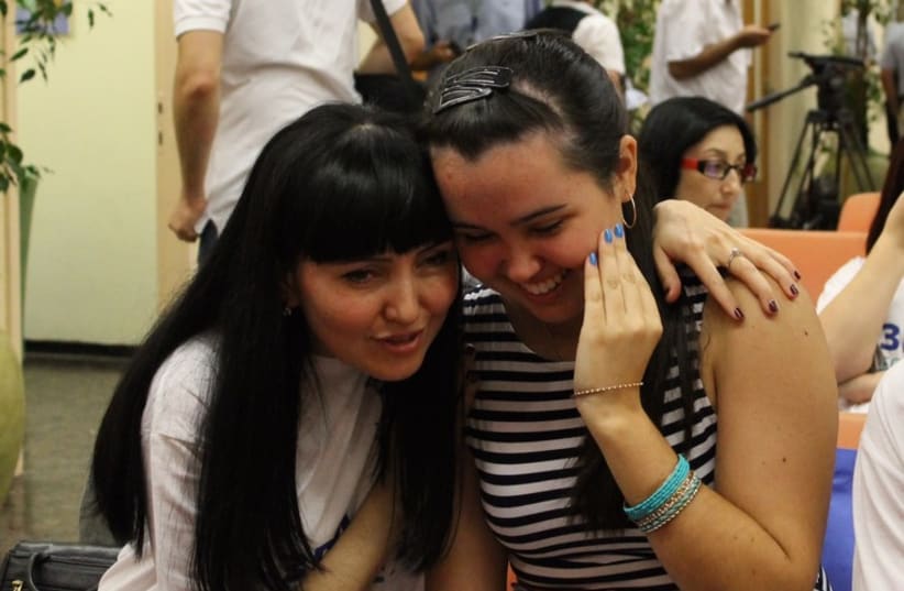Alexandrina Zheludev hugs her mother who escaped from Luhansk to meet her in Israel (photo credit: SAM SOKOL)