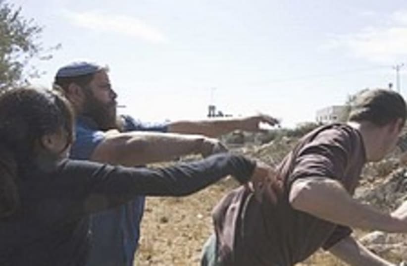 settlers leftist clash hebron 224.88 (photo credit: Active Stills)
