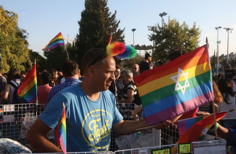 Celebrants march in the gay pride parade. (photo credit: MARC ISRAEL SELLEM/THE JERUSALEM POST)