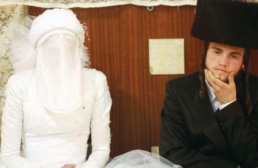 An Ultra-orthodox couple at their wedding in Bnei Brak. (photo credit: ILLUSTRATIVE: MARC ISRAEL SELLEM)