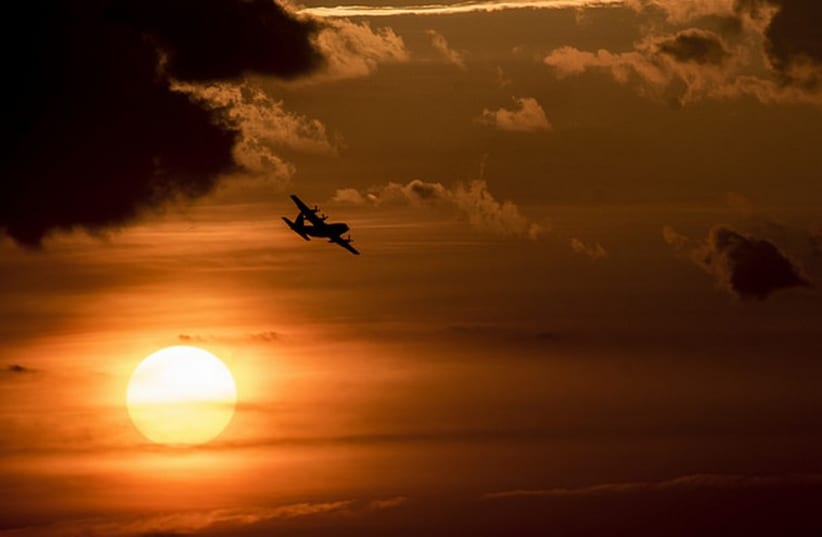 A U.S. Air Force Reserve aircrew flying a C-130 Hercules aircraft assigned to the 910th Airlift Wing, Youngstown Air Reserve Station, Ohio, performs aerial spraying June 25, 2014, over Joint Base (JB) Charleston, S.C.  (photo credit: US DEPARTMENT OF DEFENSE)