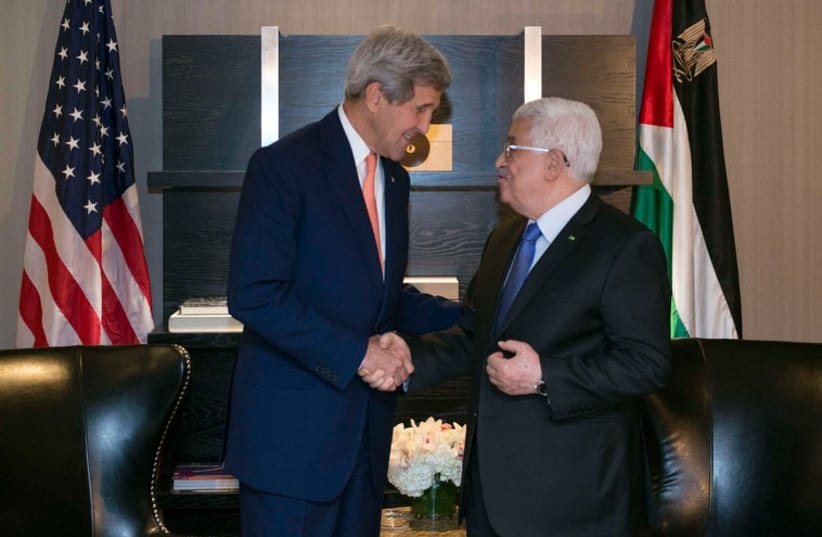US Secretary of State John Kerry shakes hands with Palestinian Authority President Mahmoud Abbas in New York, September 23 (photo credit: REUTERS)
