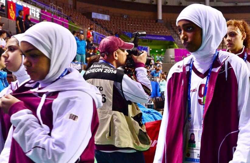 Qatar women's basketball team walking off the court at the Asian Games. (photo credit: REUTERS)