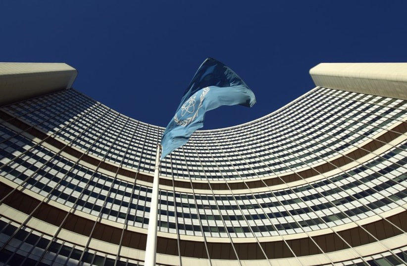 The flag of the International Atomic Energy Agency (IAEA) flies in front of its headquarters in Vienna  (photo credit: REUTERS)