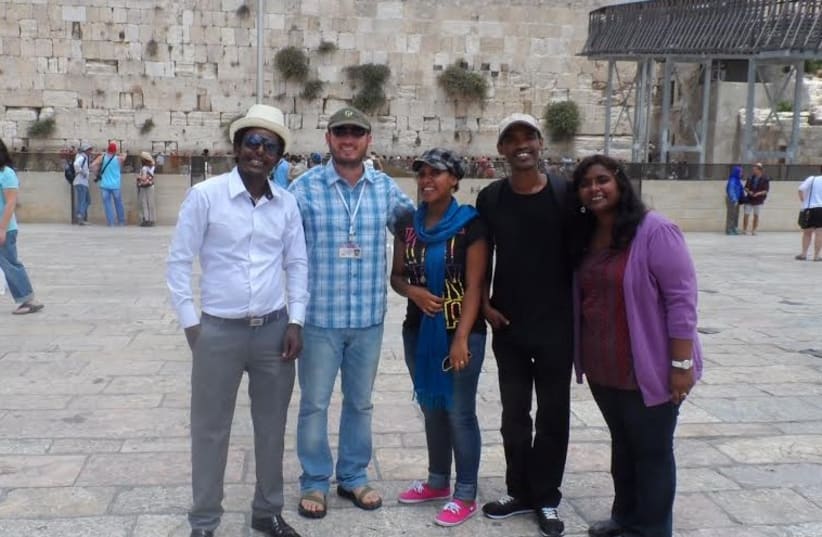 Students with guide at the Western Wall in Jerusalem  (photo credit: PR)