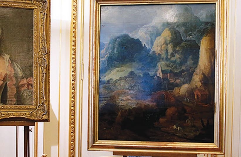 THREE PAINTINGS seized by the Nazis are displayed at an official ceremony in Paris March 11, 2014 (photo credit: REUTERS)
