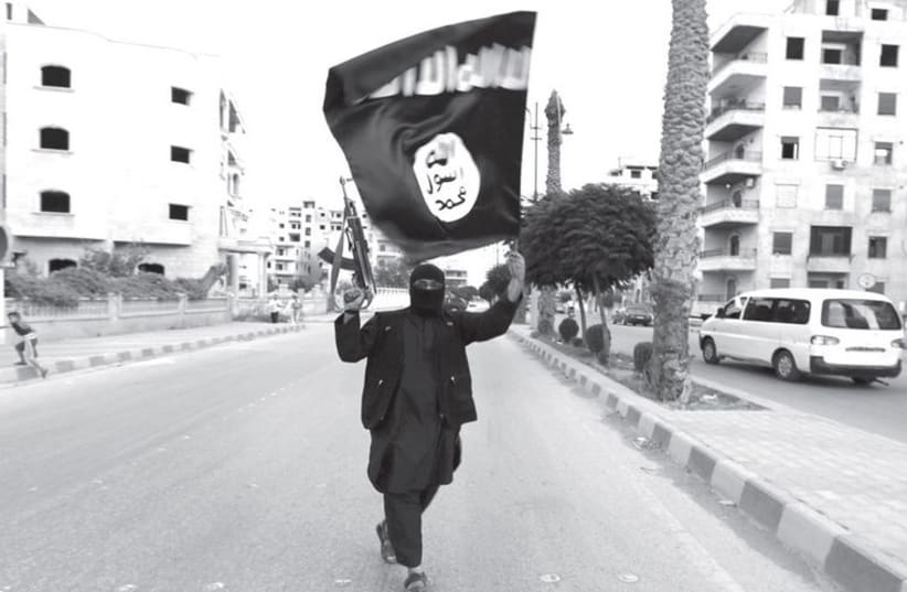 ISIS militant (photo credit: REUTERS)