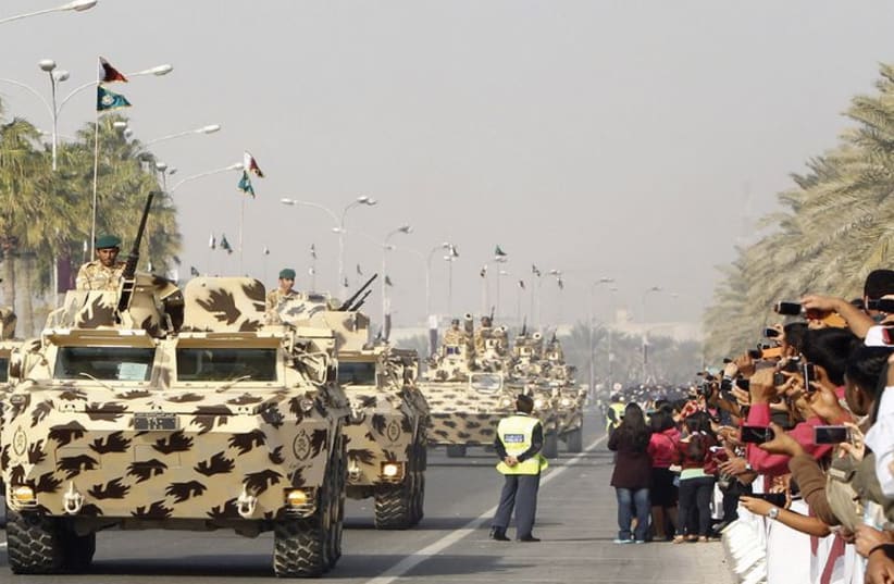 Qatar’s army takes part in a military parade in Doha. (photo credit: REUTERS)