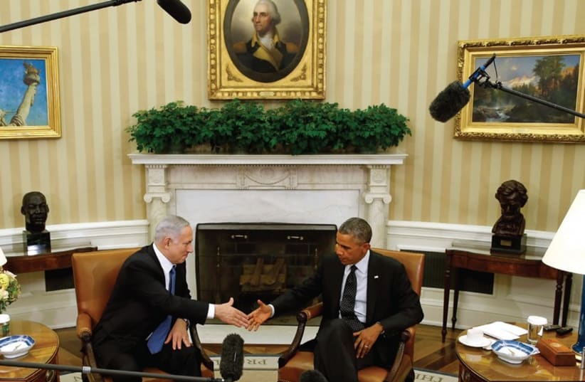  Prime Minister Binyamin Netanyahu shakes hands with US President Barack Obama at the White House (photo credit: KEVIN LAMARQUE/REUTERS)