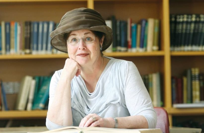 Malka Bina sits in the library of the institute she founded, the Sadie Rennert Women’s Institute for Torah Studies. (photo credit: Courtesy)