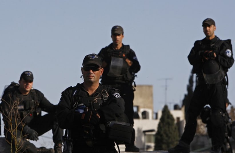 Israeli security forces stand guard during a protest in east Jerusalem (photo credit: REUTERS)