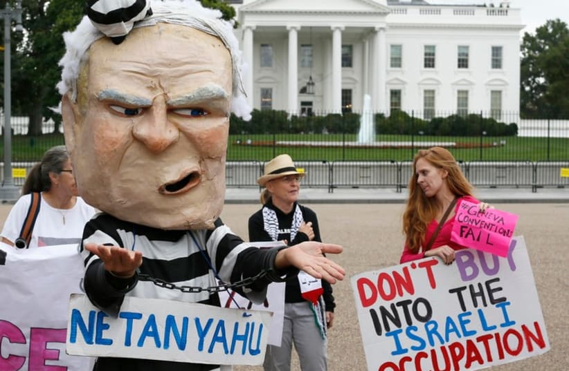 Protesters demonstrate against Prime Minister Binyamin Netanyahu during his meeting with US President Barack Obama at the White House (photo credit: REUTERS)