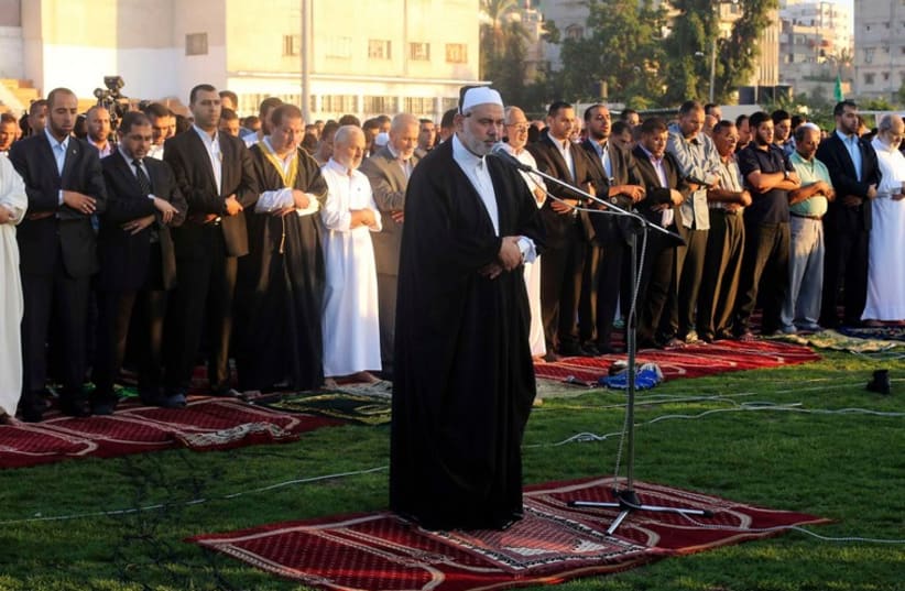 Hamas leader Ismail Haniyeh leads Eid al-Adha prayers in Gaza City (photo credit: REUTERS)