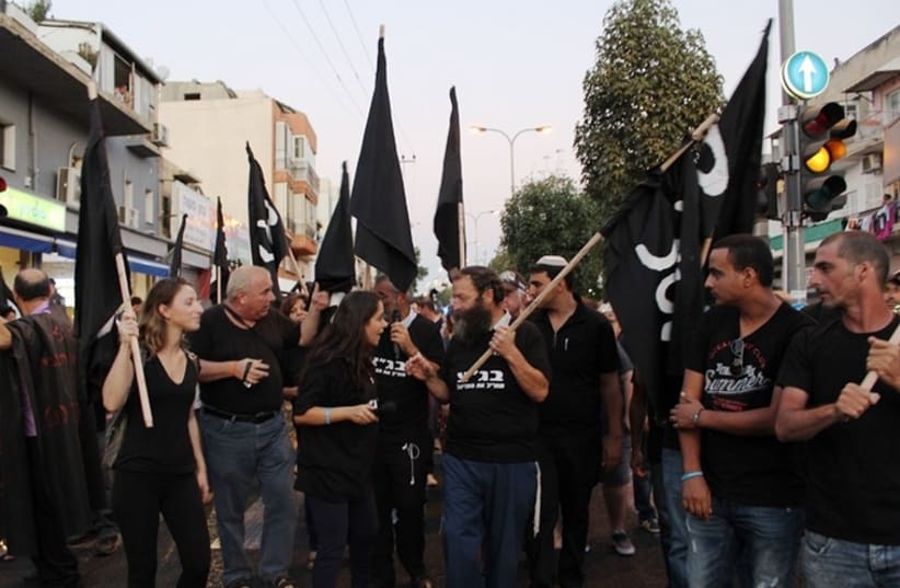 Residents of south Tel Aviv rally against High Court (photo credit: BEN HARTMAN)