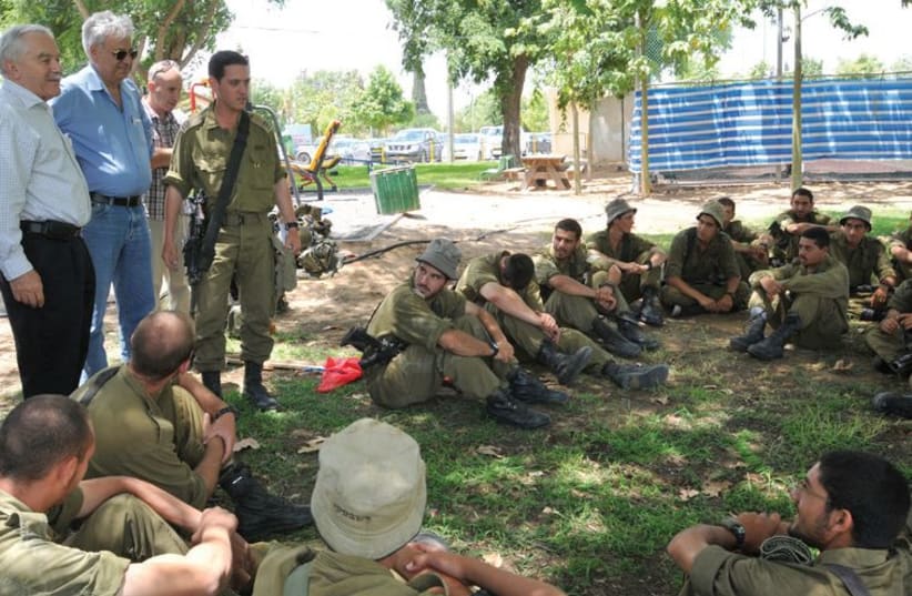 Agriculture Minister Yair Shamir speaks to soldiers in the Eshkol region during this summer’s conflict with Gaza. (photo credit: JEVGENIYA KRAVCHIK)