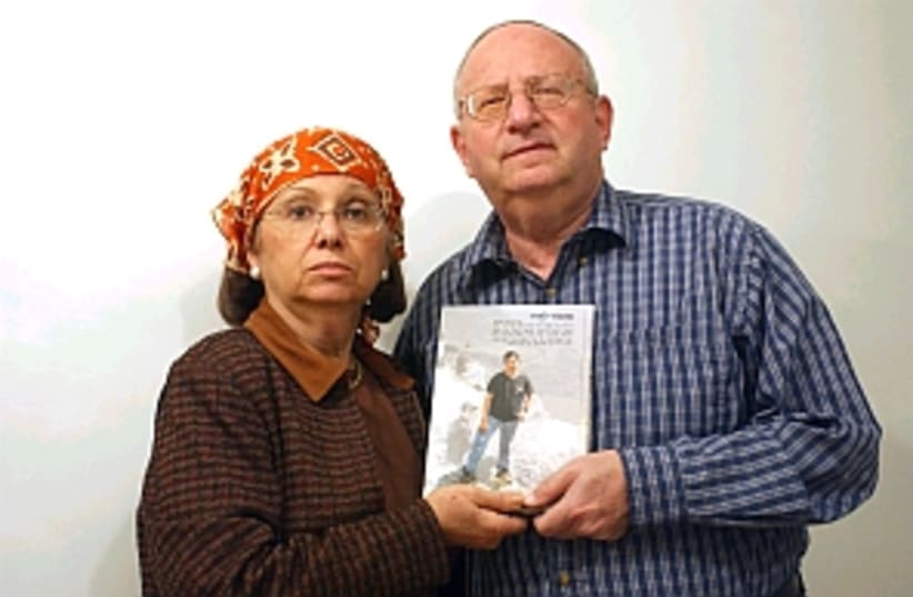 Stanley and Joyce Boim hold a photo of their son David who was murdered by terrorists (photo credit: Ariel Jerozolimski)