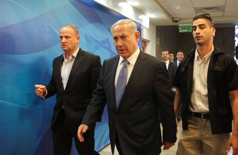 Prime Minister Benjamin Netanyahu arrives at a cabinet meeting in Jerusalem October 7 (photo credit: REUTERS)