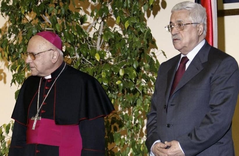 Former Latin Patriarch of Jerusalem Michel Sabbah (L) and PA President Mahmoud Abbas stand together during a meeting in Bethlehem in 2007. (photo credit: REUTERS)